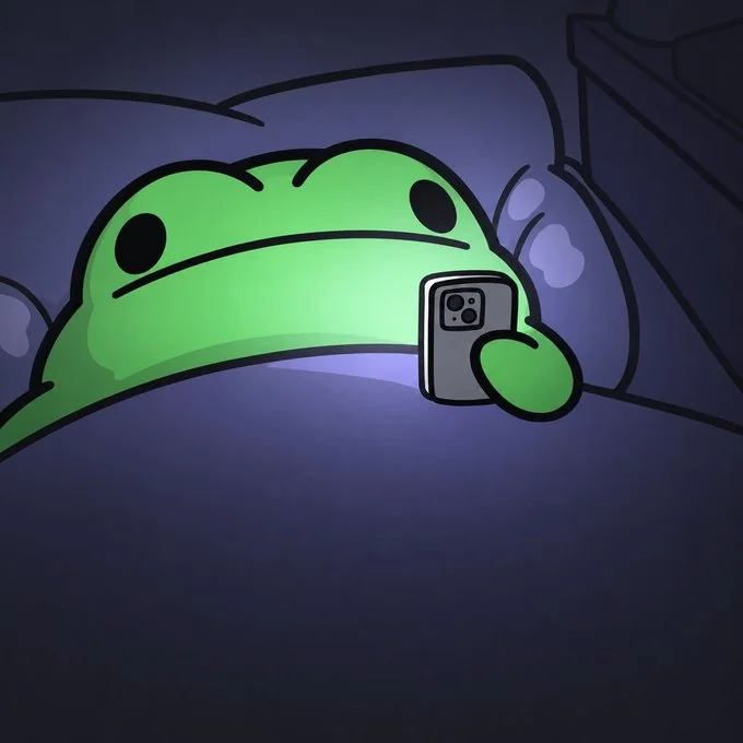 wibet in bed looking at a phone in the dark